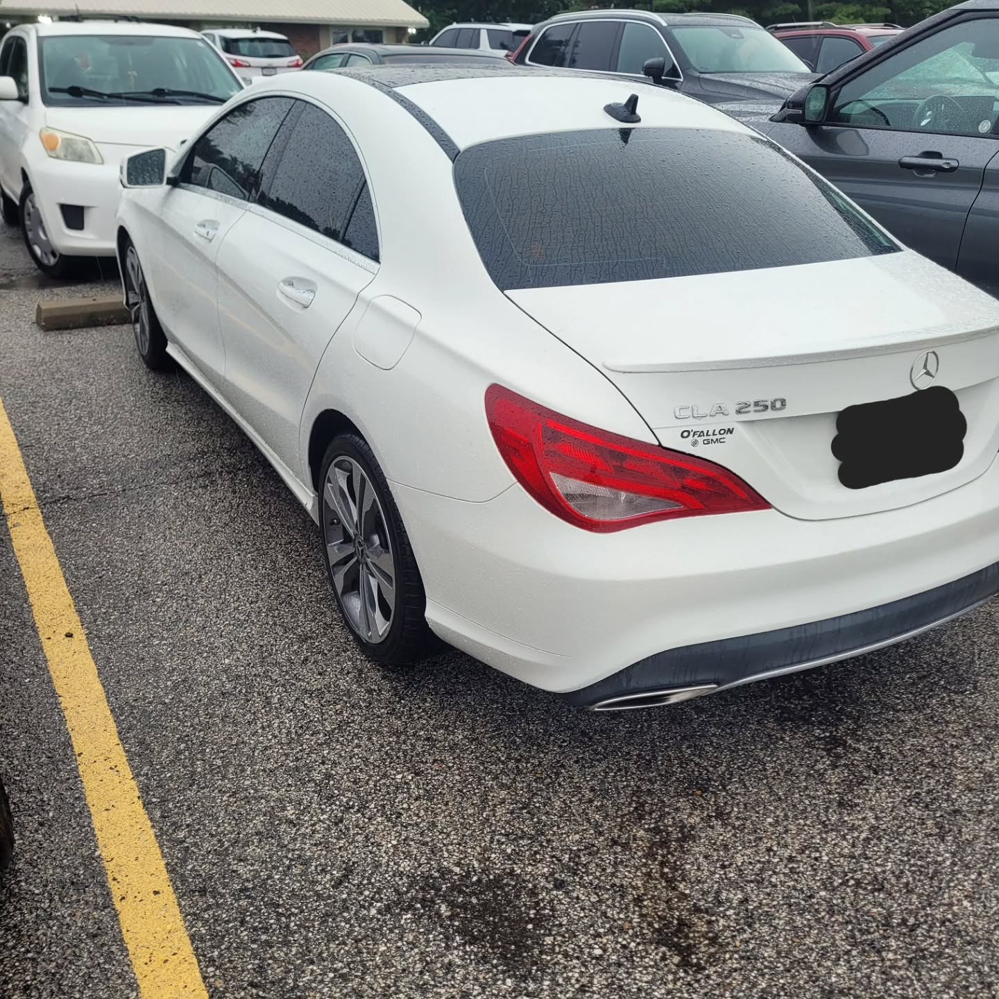 White Mercedes CLA 250 parked in a lot after front brake service